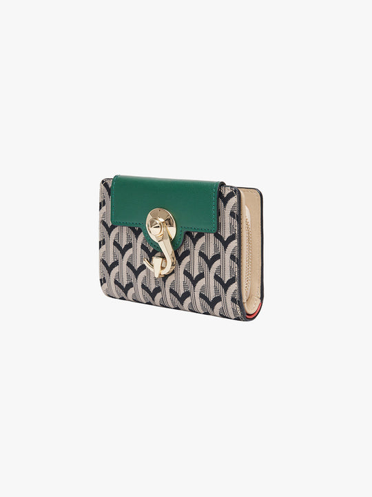 Green and patterned wallet with a gold emblem on a white background