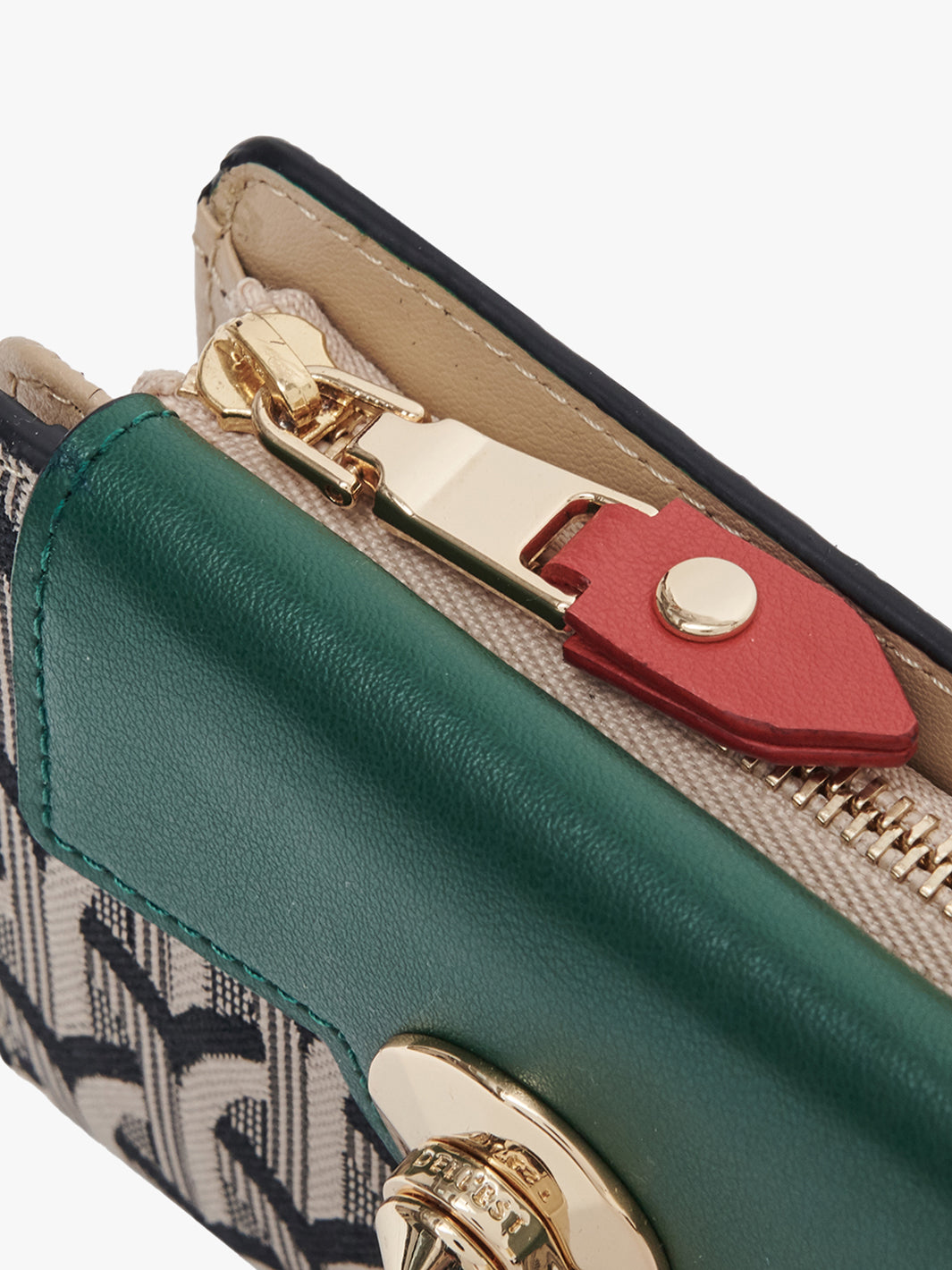 Close-up of a green wallet with a red lock and gold zipper.
